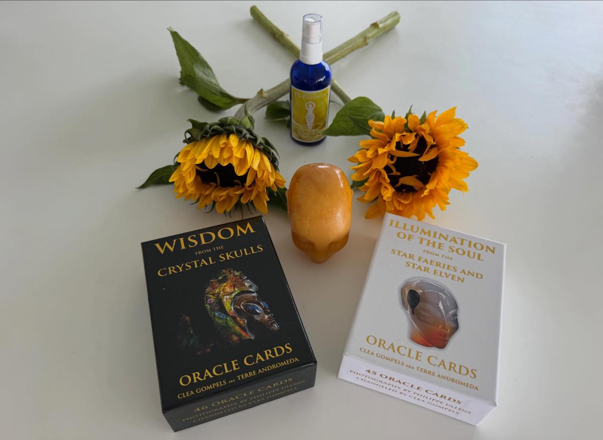 The Illumination essence with both oracle decks and sunflowers